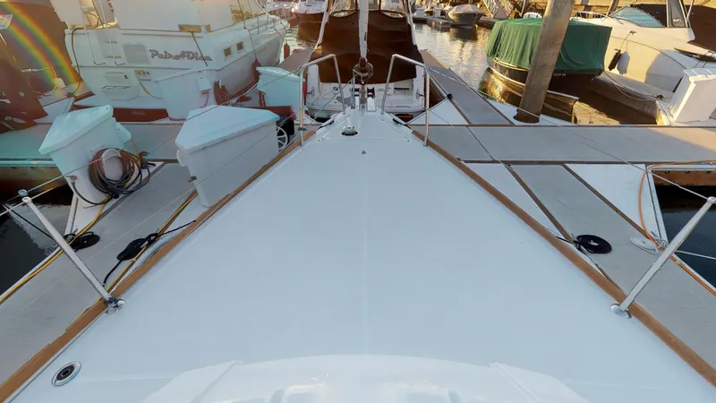 Wanderlust Yacht Photos Pics Beneteau Oceanis 38.1 yacht deck, 2019 model, docked at marina with surrounding boats.