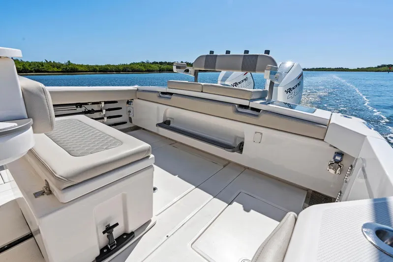  Yacht Photos Pics 2025 Solace 32 CS boat interior with seating, open water view, and dual engines.