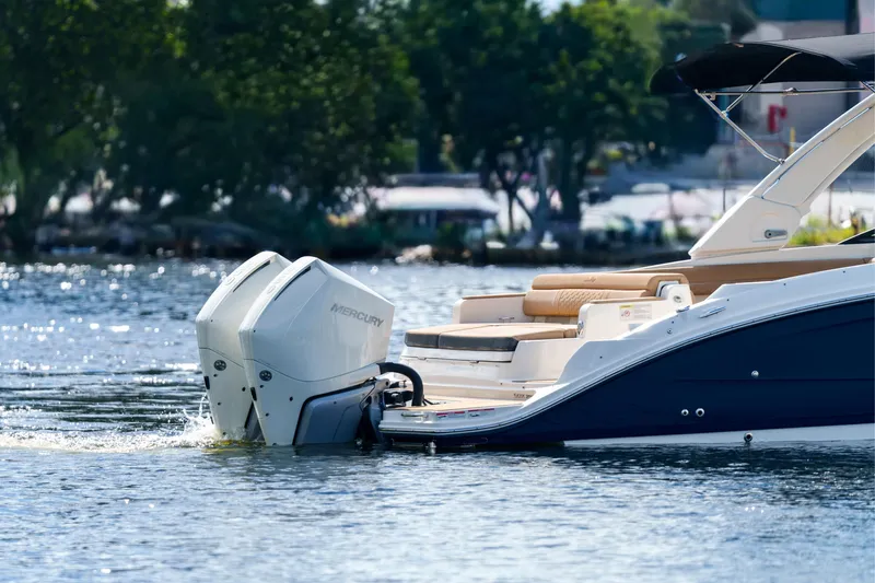  Yacht Photos Pics Sea Ray boat with Mercury outboard engines on a calm lake.