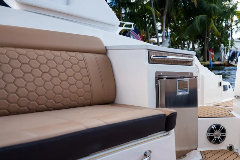  Yacht Photos Pics Luxurious Sea Ray boat interior with tan seating and stainless steel accents.