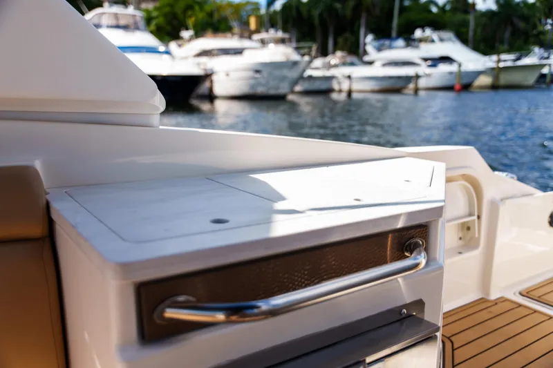  Yacht Photos Pics Luxury Sea Ray boat interior with sleek design, docked near other yachts.