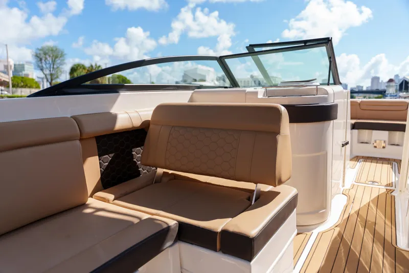  Yacht Photos Pics Luxurious Sea Ray boat interior with tan leather seating and sleek design.