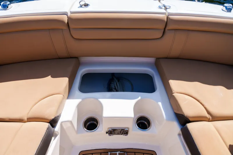  Yacht Photos Pics Interior view of a Sea Ray boat with tan seating and cup holders.