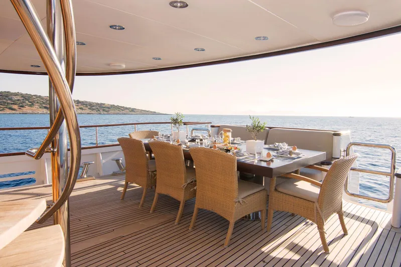 Parvati Yacht Photos Pics Outdoor dining area on 1979 CRN Displacement yacht, overlooking the sea.
