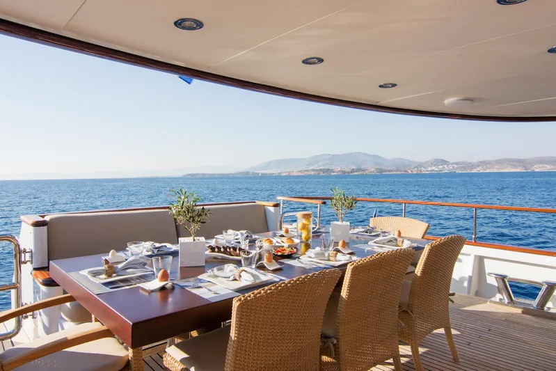 Parvati Yacht Photos Pics Luxurious dining setup on 1979 CRN Displacement yacht with ocean view.