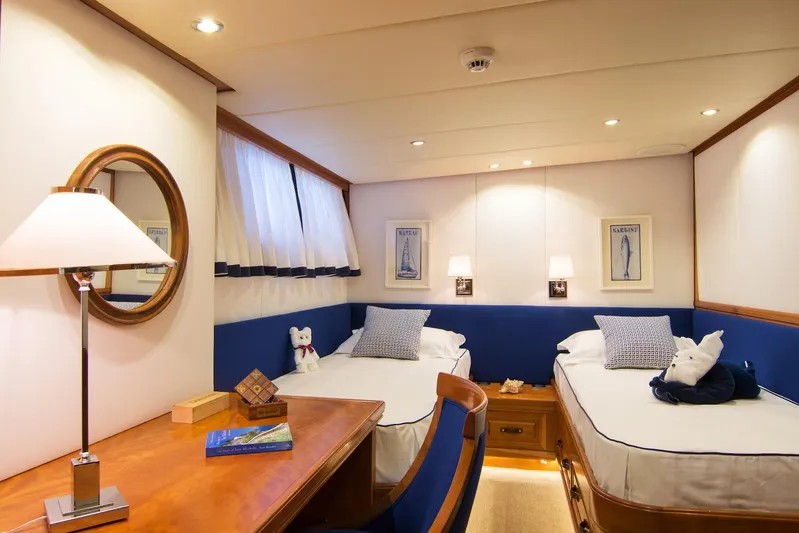 Parvati Yacht Photos Pics Luxurious 1979 CRN Displacement yacht cabin with twin beds and elegant decor.