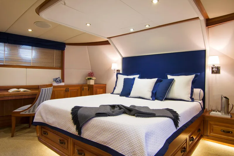 Parvati Yacht Photos Pics Luxurious 1979 CRN Displacement yacht bedroom with elegant decor and cozy lighting.