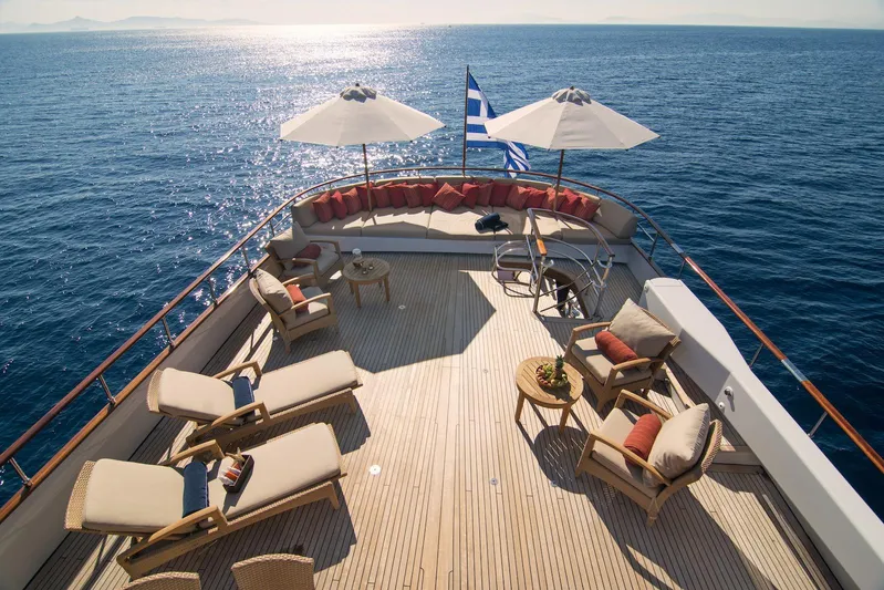 Parvati Yacht Photos Pics Luxurious 1979 CRN Displacement yacht deck with sun loungers and sea view.