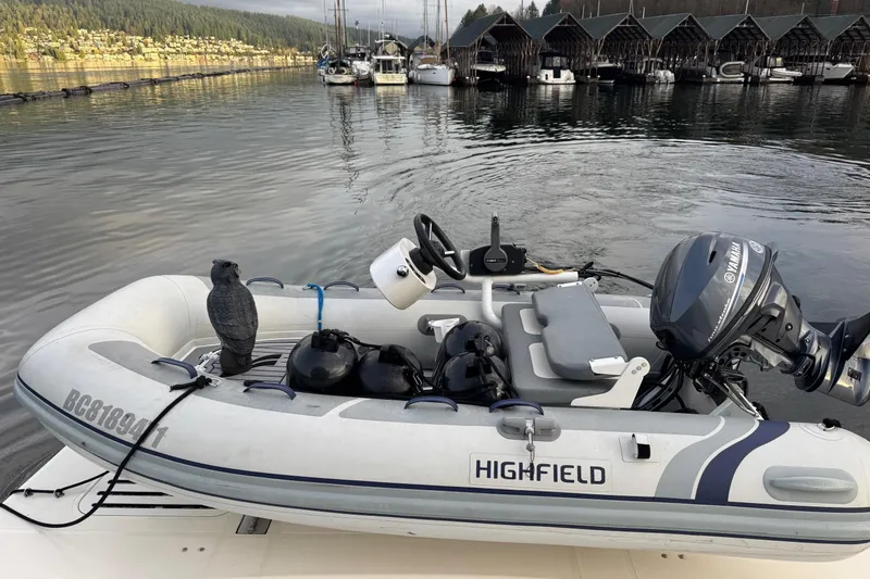 Covetime II Yacht Photos Pics Inflatable boat with Yamaha motor docked near Sea Ray 44 Sedan Bridge, 2006 model.