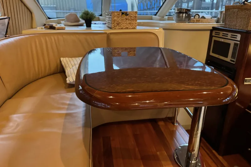 Covetime II Yacht Photos Pics Luxurious interior of 2006 Sea Ray 44 Sedan Bridge yacht with elegant dining area.