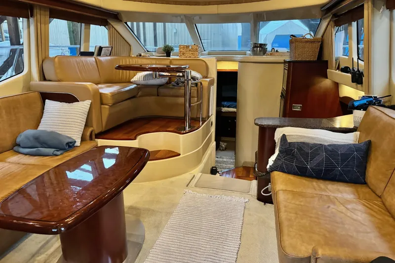 Covetime II Yacht Photos Pics Luxurious interior of a 2006 Sea Ray 44 Sedan Bridge yacht with elegant seating and decor.