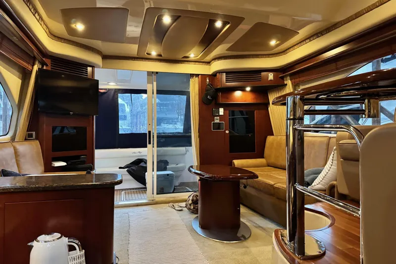 Covetime II Yacht Photos Pics Luxurious interior of a 2006 Sea Ray 44 Sedan Bridge yacht with elegant furnishings.