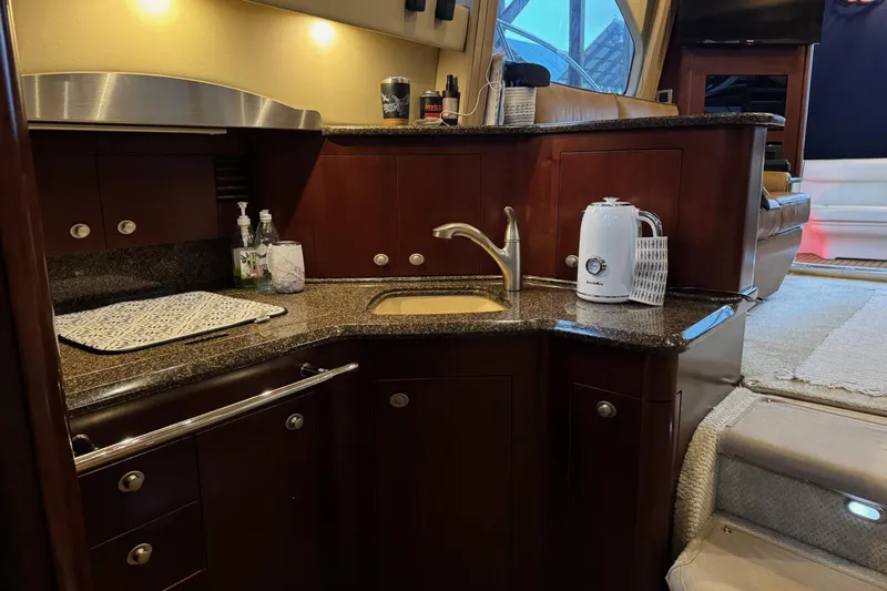 Covetime II Yacht Photos Pics Luxurious kitchen area in a 2006 Sea Ray 44 Sedan Bridge yacht.