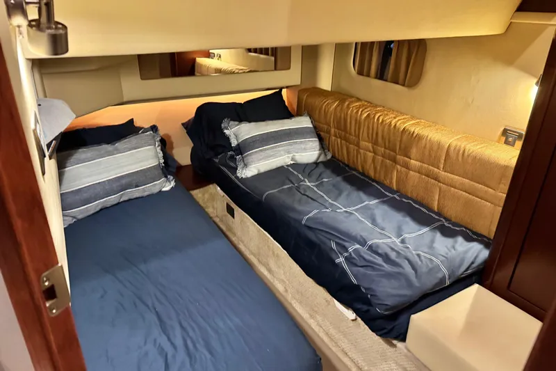 Covetime II Yacht Photos Pics Interior cabin of 2006 Sea Ray 44 Sedan Bridge with twin beds and cozy decor.