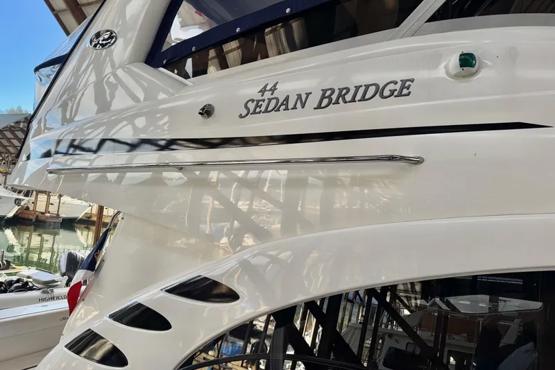 Covetime II Yacht Photos Pics 2006 Sea Ray 44 Sedan Bridge yacht docked in marina, showcasing sleek design.