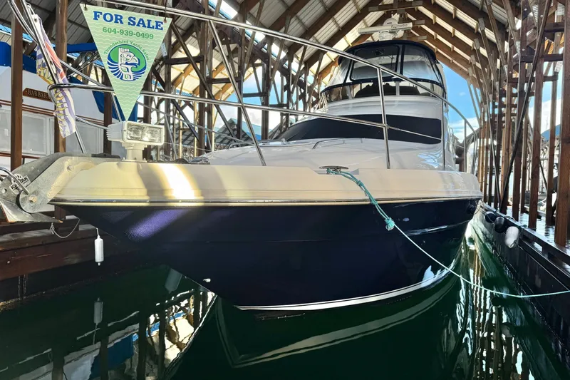 Covetime II Yacht Photos Pics 2006 Sea Ray 44 Sedan Bridge yacht for sale, docked in a covered marina.