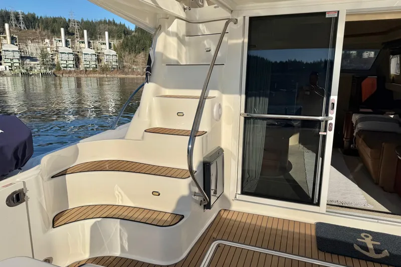 Covetime II Yacht Photos Pics 2006 Sea Ray 44 Sedan Bridge yacht with teak steps and sliding glass door.