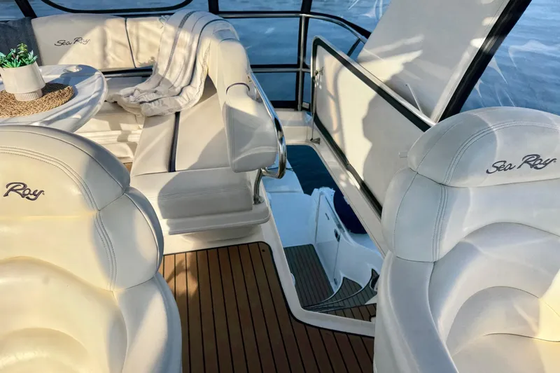 Covetime II Yacht Photos Pics Luxurious interior of 2006 Sea Ray 44 Sedan Bridge yacht with plush seating.