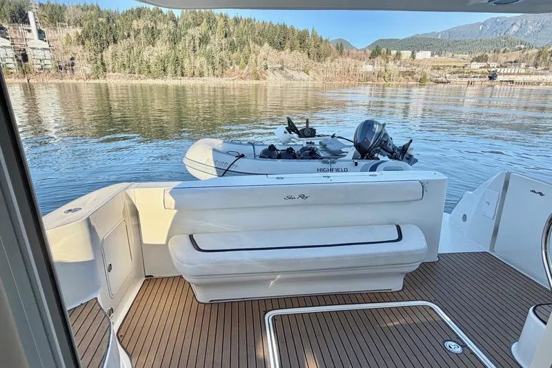 Covetime II Yacht Photos Pics 2006 Sea Ray 44 Sedan Bridge yacht with scenic water and forest backdrop.