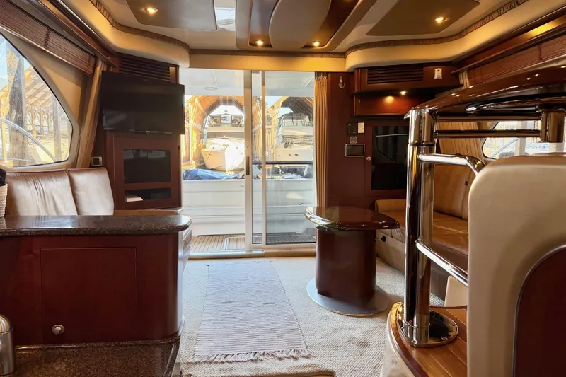 Covetime II Yacht Photos Pics Luxurious interior of a 2006 Sea Ray 44 Sedan Bridge yacht with elegant furnishings.