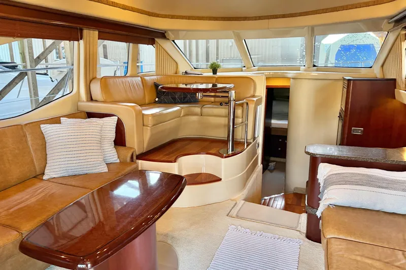 Covetime II Yacht Photos Pics Luxurious interior of a 2006 Sea Ray 44 Sedan Bridge yacht with elegant seating.