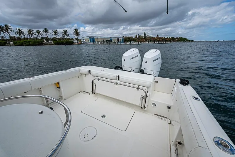  Yacht Photos Pics 2007 Triton 351 CC boat with dual Mercury engines on a scenic waterway.