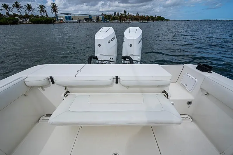  Yacht Photos Pics 2007 Triton 351 CC boat with twin Mercury engines on calm water.