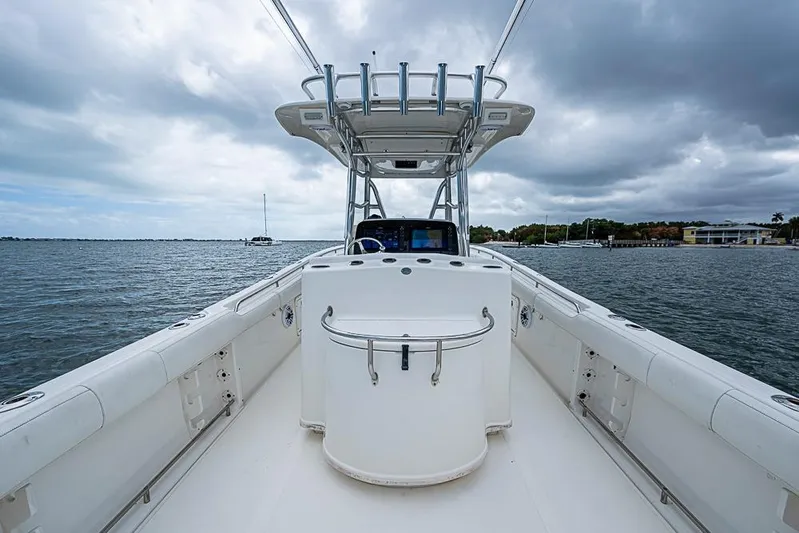  Yacht Photos Pics 2007 Triton 351 CC boat on water under cloudy sky.
