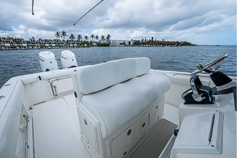  Yacht Photos Pics 2007 Triton 351 CC boat with dual Mercury engines on a scenic waterfront.