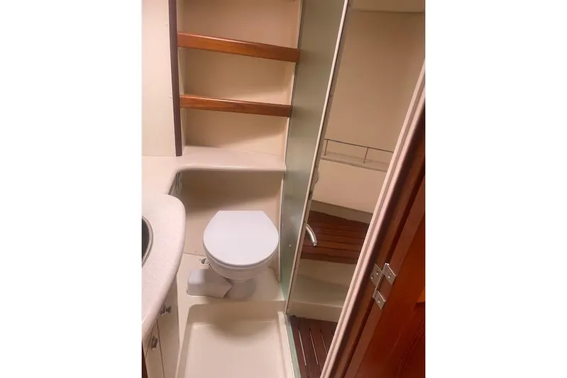 The Boat Yacht Photos Pics Bathroom interior of 2007 Marlow-Hunter 45CC yacht with toilet and shower.