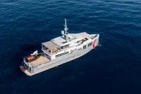Custom 2024 K584 Hull 2 yacht cruising on open sea, aerial view.