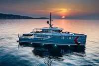 Luxurious 2024 Custom K584 Hull 2 yacht at sunset on calm waters.