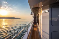 Luxurious 2024 Custom K584 Hull 2 yacht at sunset on calm waters.