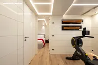 Luxurious yacht interior with modern gym equipment, sleek design, and elegant lighting, 2024 Custom K584 Hull 2.