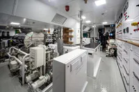 Engine room of 2024 Custom K584 Hull 2 yacht, featuring advanced machinery and control panels.
