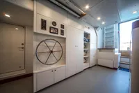Modern ship interior with control panel and storage, Custom K584 Hull 2, 2024 model.
