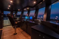 Luxurious 2024 Custom K584 Hull 2 yacht interior with modern control panel at sunset.