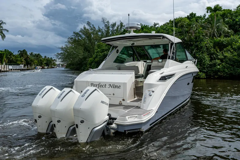  Yacht Photos Pics 2023 Sea Ray Sundancer 320 Outboard cruising on a scenic waterway.