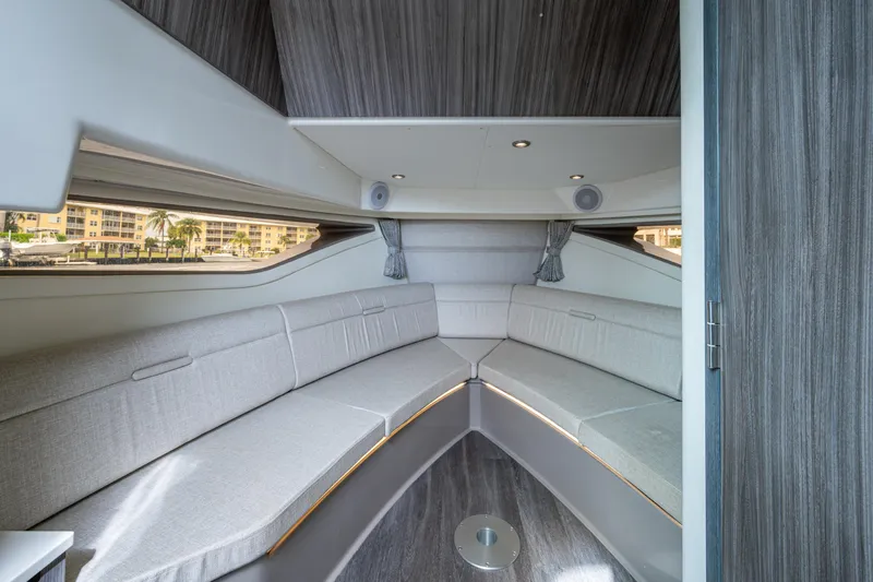  Yacht Photos Pics 2023 Sea Ray Sundancer 320 Outboard cabin interior with sleek seating and modern design.
