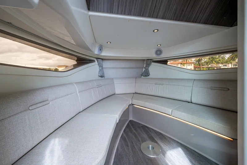  Yacht Photos Pics Luxurious interior of 2023 Sea Ray Sundancer 320 Outboard with elegant seating and modern design.