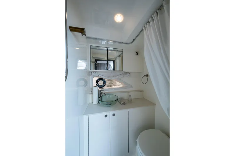 Yacht Photos Pics 2023 Sea Ray Sundancer 320 Outboard bathroom with modern fixtures and elegant design.