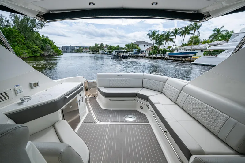  Yacht Photos Pics Luxurious 2023 Sea Ray Sundancer 320 Outboard interior with waterfront view.