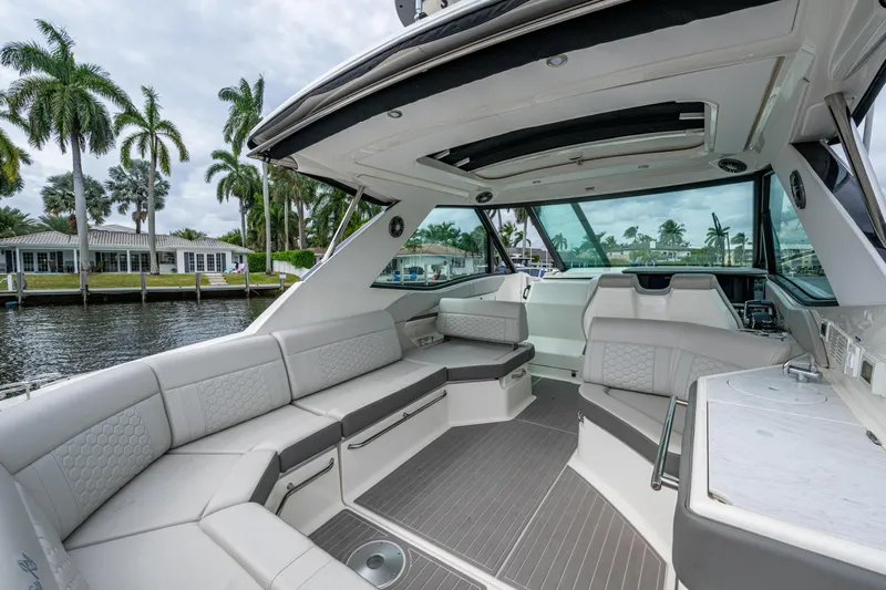  Yacht Photos Pics 2023 Sea Ray Sundancer 320 Outboard interior with luxurious seating and modern design.