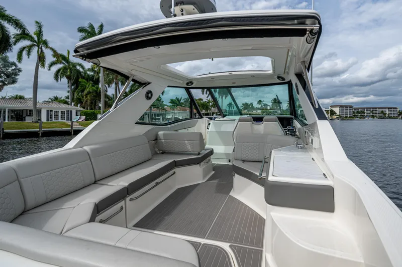  Yacht Photos Pics Luxurious 2023 Sea Ray Sundancer 320 Outboard boat interior with spacious seating and modern design.