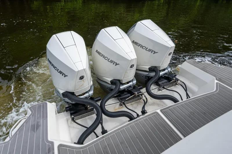  Yacht Photos Pics 2023 Sea Ray Sundancer 320 Outboard with triple Mercury engines on water.