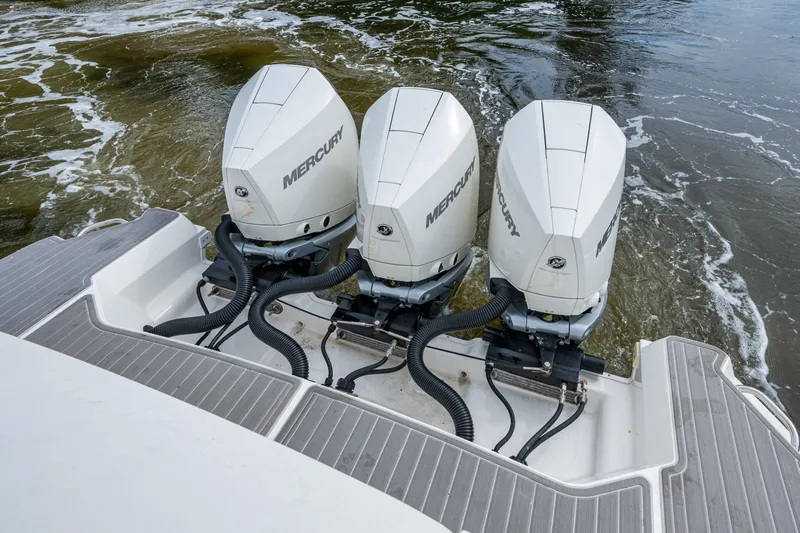  Yacht Photos Pics 2023 Sea Ray Sundancer 320 Outboard with triple Mercury engines on water.