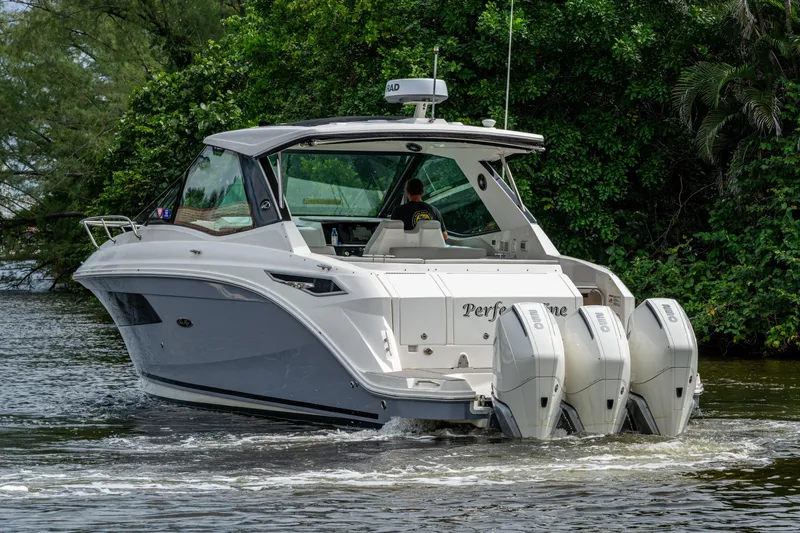  Yacht Photos Pics 2023 Sea Ray Sundancer 320 Outboard cruising on a scenic waterway.