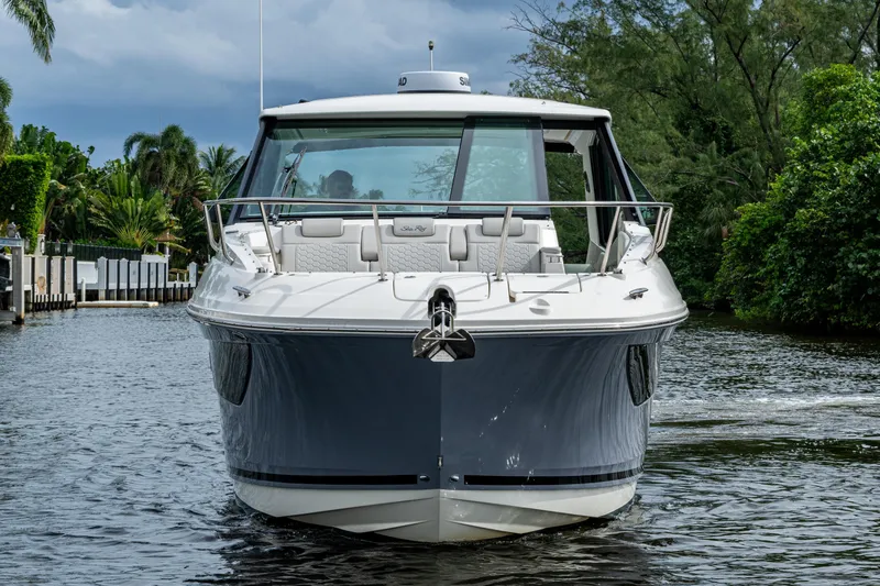 Yacht Photos Pics 2023 Sea Ray Sundancer 320 Outboard cruising on a scenic waterway.
