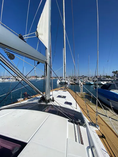  Yacht Photos Pics 2013 Jeanneau 57 sailboat docked in a sunny marina.