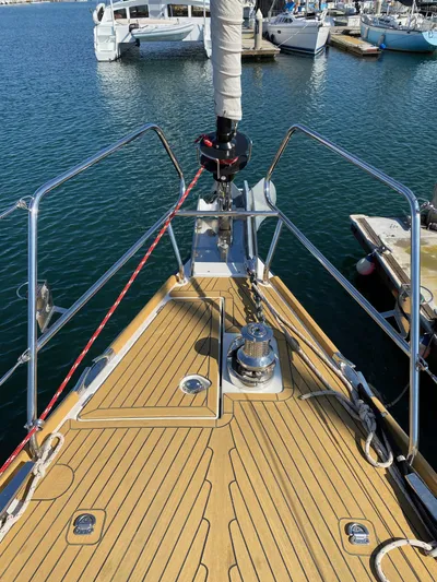  Yacht Photos Pics 2013 Jeanneau 57 sailboat deck with teak finish, docked at marina.